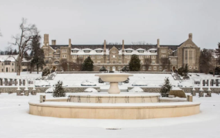Masonic Village at Elizabethtown stone building and fountain in the snow.