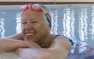 Smiling Woman in Swimming Pool.