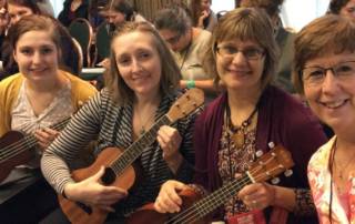 Music Village music therapists hold ukes