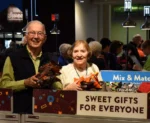 Smiling senior couple shopping together.