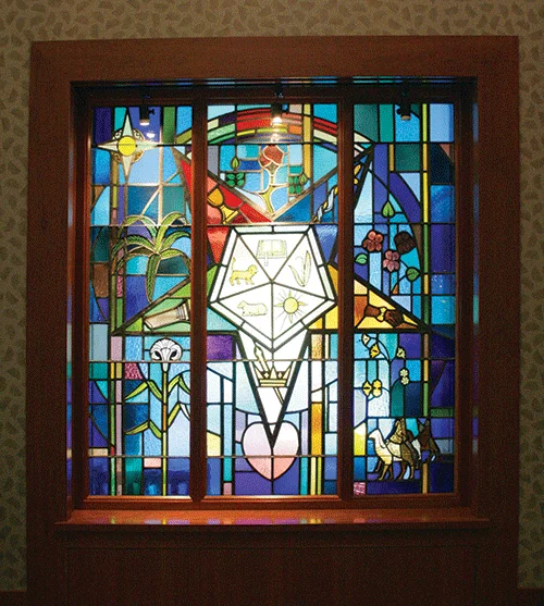 Stained glass window depicting Order of the Eastern Star logo.