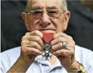 Russell Decker poses with his Legion of Honour Medal