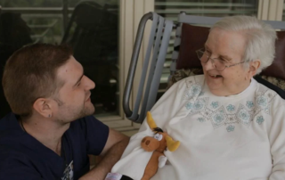 Nurses and residents interact during a video celebrating national nurses week.