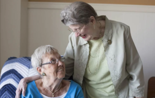 Catherine and Dottie, smiling women with arms around each other, have been best friends for over 60 years.