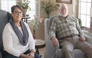 Denise and David Koch, residents sitting together in their home.