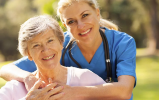 Middle-aged woman with her arms around older woman