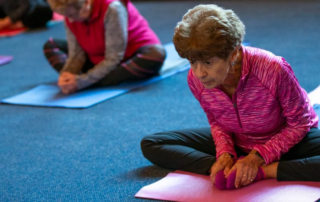 Woman leaning forward in yoga pose.