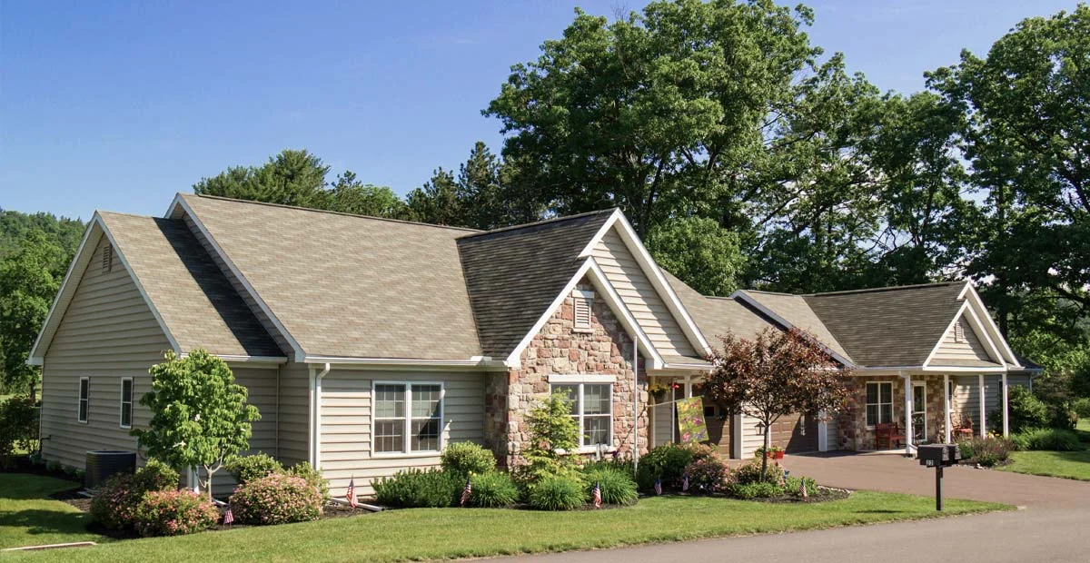 Villas with garages and driveway.