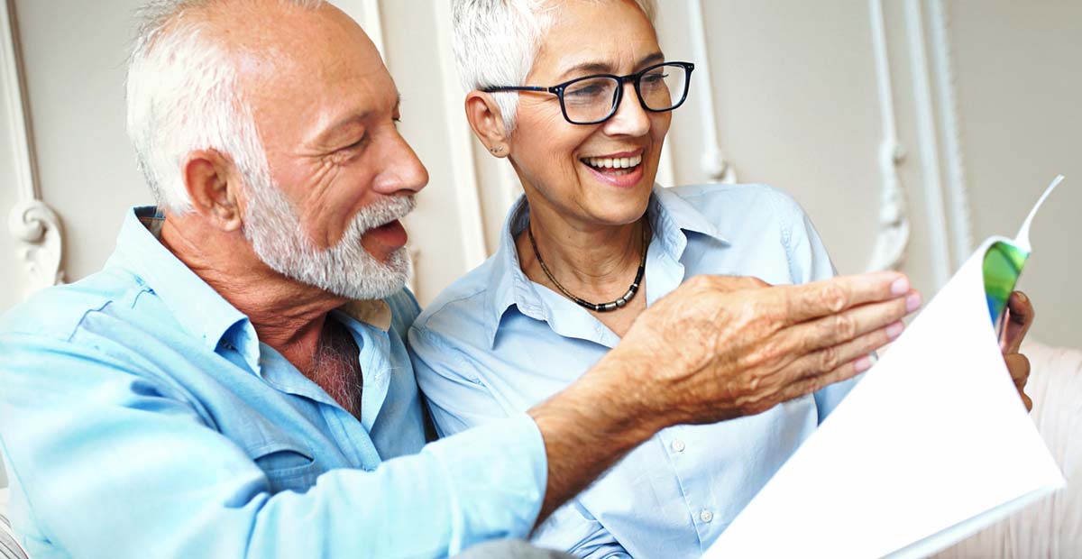 Couple Looking Through Booklet