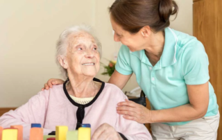 Elderly woman with caregiver