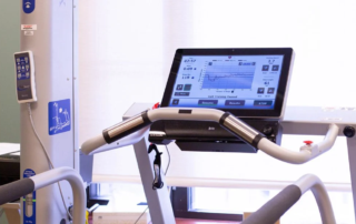 BioDex Treadmill and Gait Trainer, exercise equipment with a computer screen.