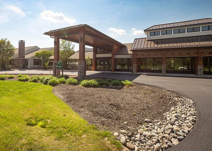 Exterior of Masonic Village at Warminster, a large building with a circular driveway.