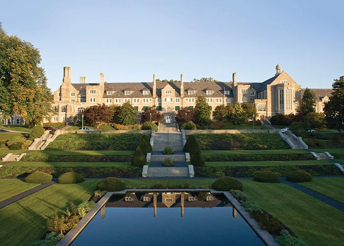 Exterior of Grand Lodge Hall with large man-made pond reflecting the building.