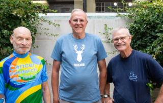 Group of smiling men standing together outdoors