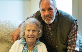 smiling man and woman pictured indoors