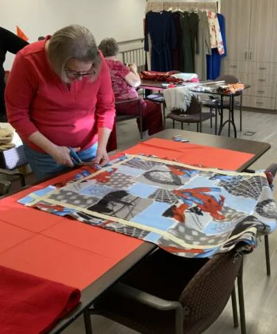 Residents make blankets for Project Linus.