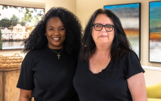 Two women smiling indoors