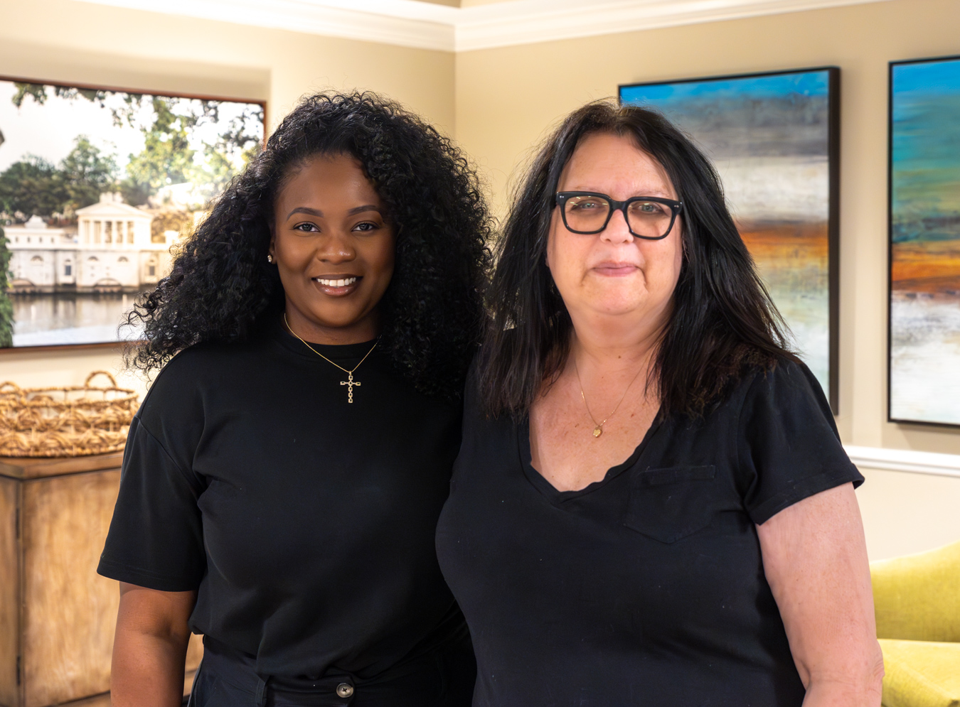 Two women smiling indoors