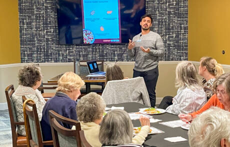 man presenting to group of people
