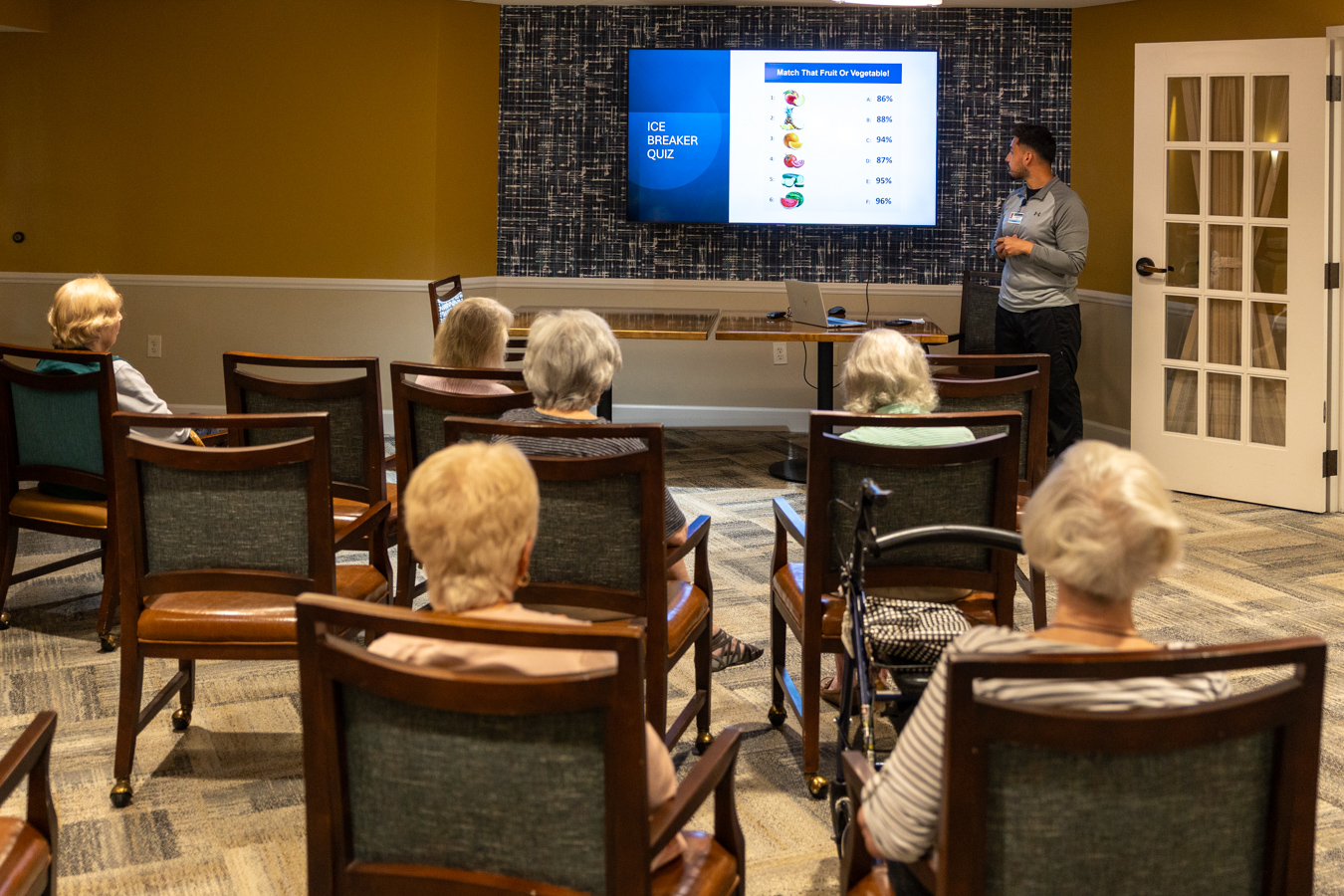 9I4A3268 Man presenting to room of residents