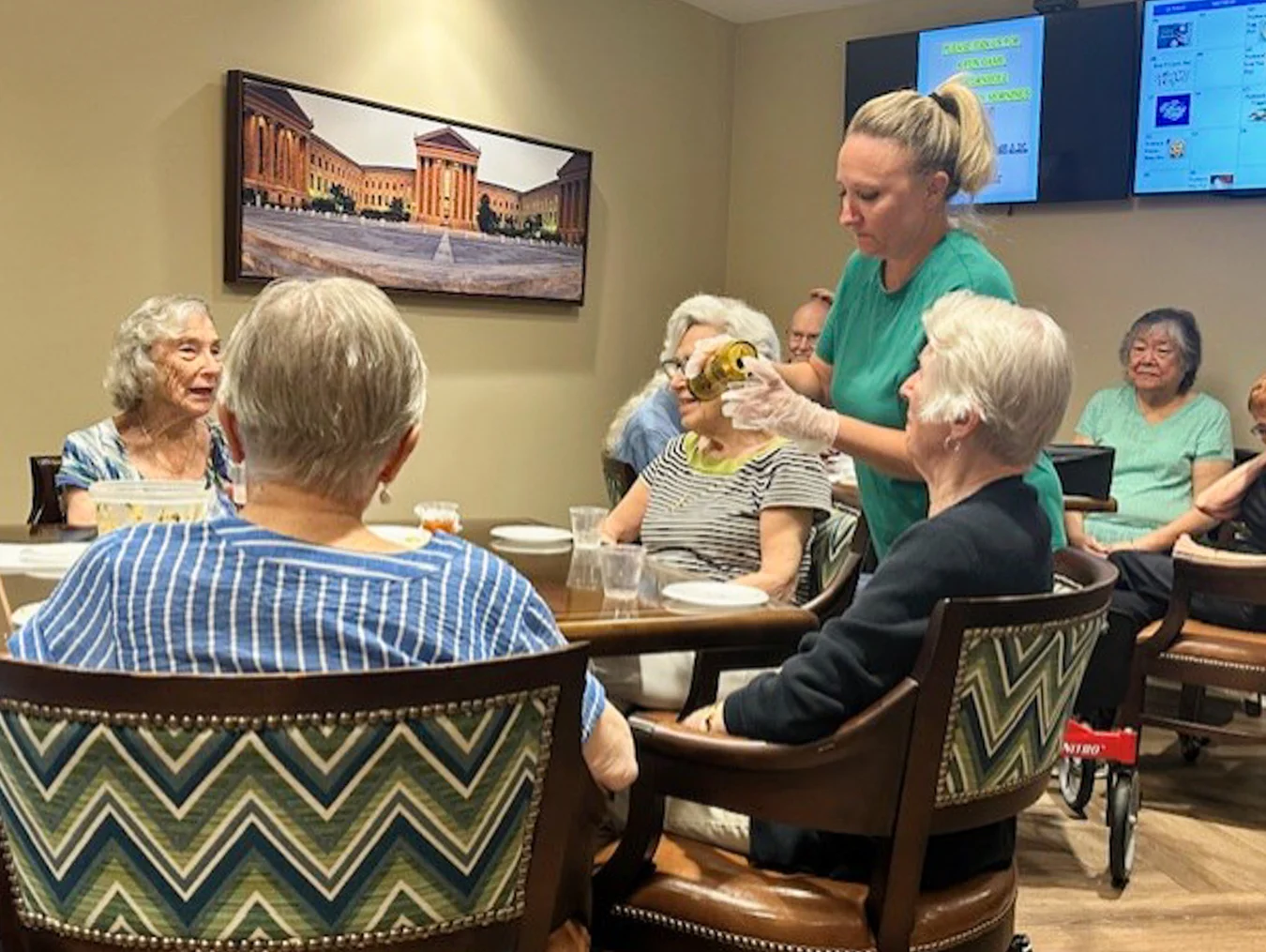 Woman pouring water for residents