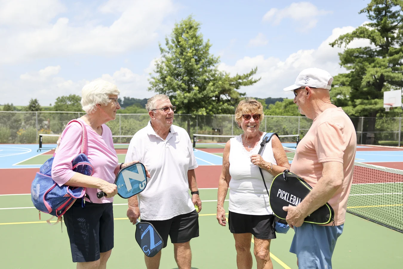 1W8A1137 Group on pickleball court with equpment