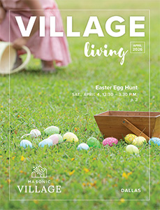 Dallas Village Living Magazine cover featuring colorful eggs laying in grass.