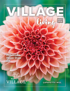 Lafayette Hill Village Living cover featuring a closeup of a flower.