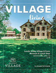 Elizabethtown Village Living cover featuring building surrounded by green grass.