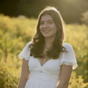 Young woman with white dress standing outdoors